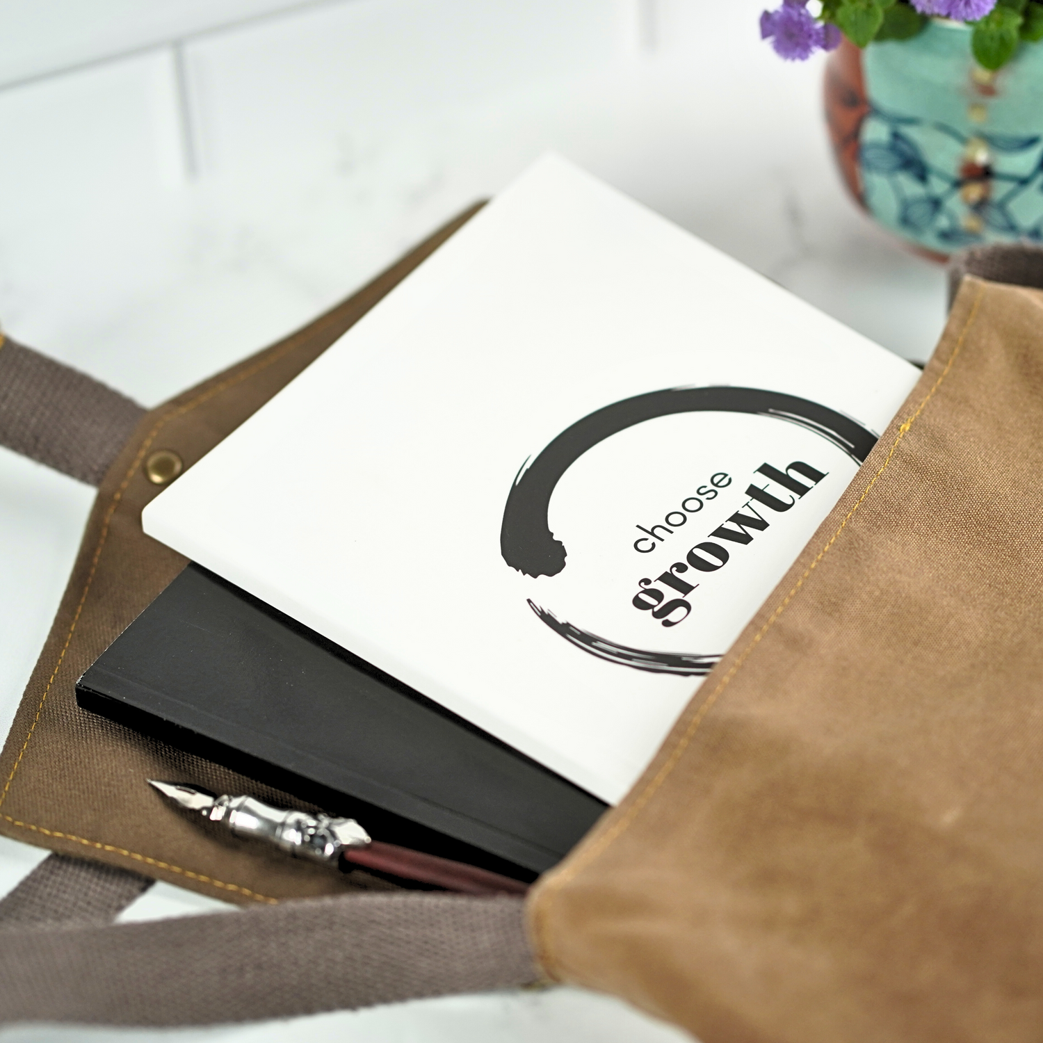 The Choose Growth Affirmation Journal by Treesnail Wellness comes with a choice of either a white or black cover.
