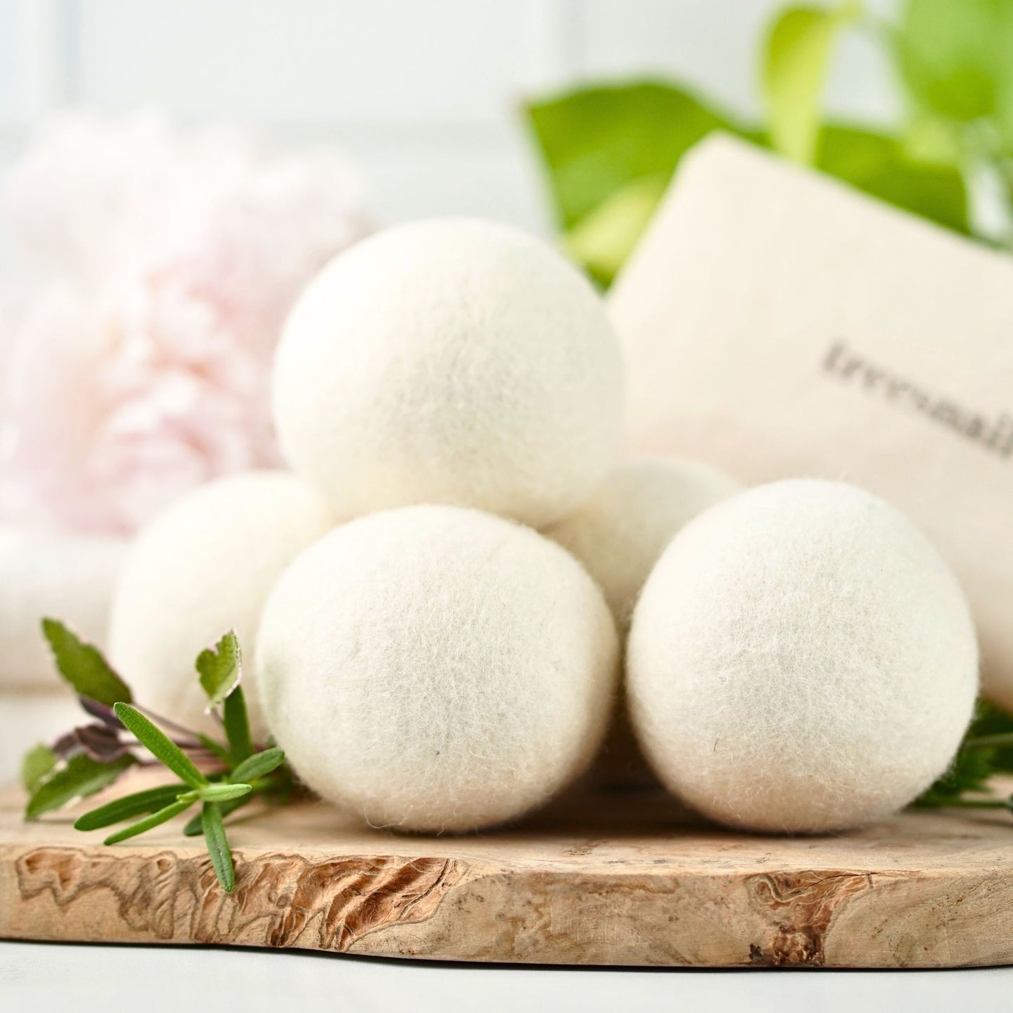 Set of 6 Organic Dryer Balls by Treesnail Wellness, packed in a sustainable cotton muslin bag. 100% natural and compostable.