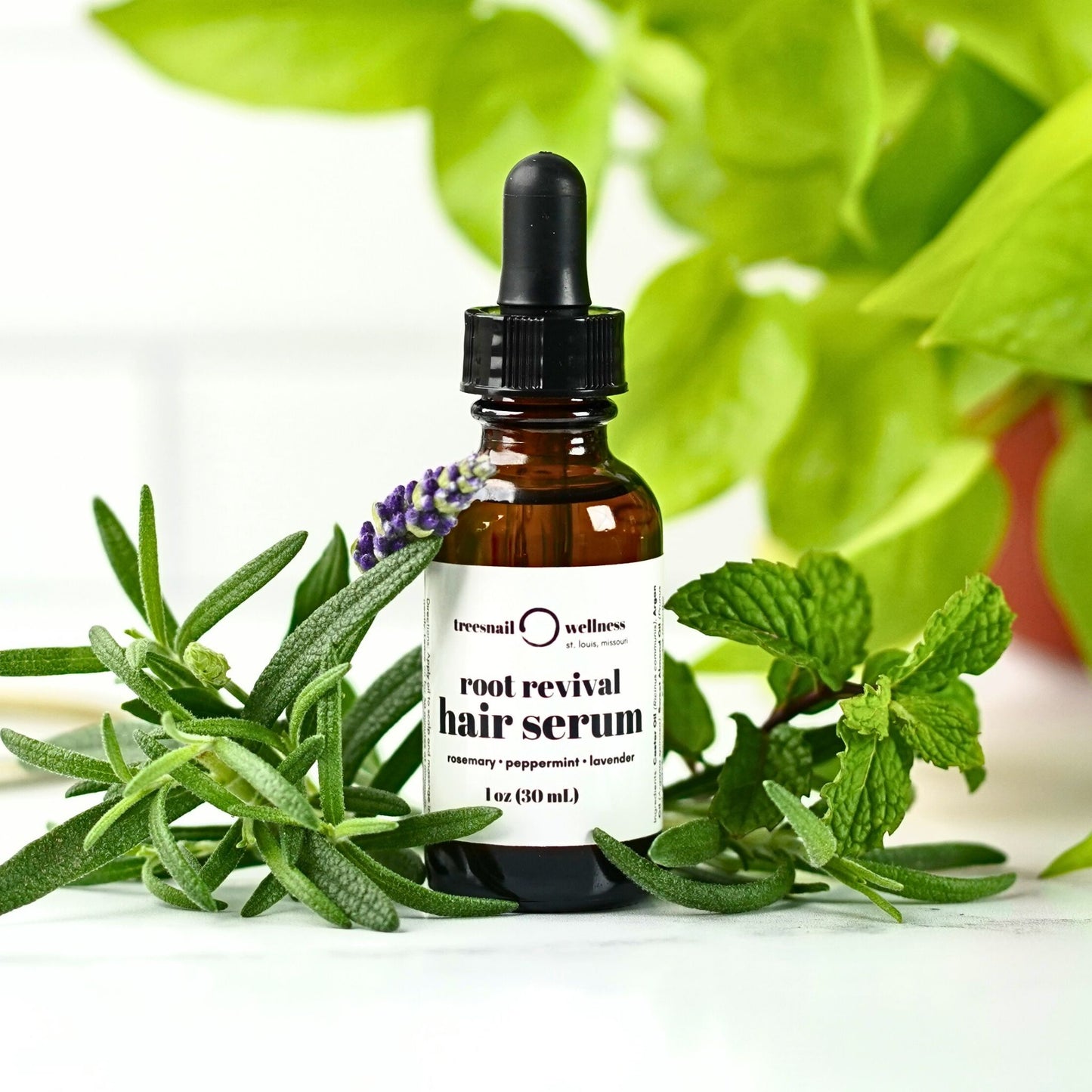 Root Revival Hair Oil by Treesnail Wellness is 100% natural and handmade in St. Louis, MO with pure carrier oils and essential oils for scalp health.