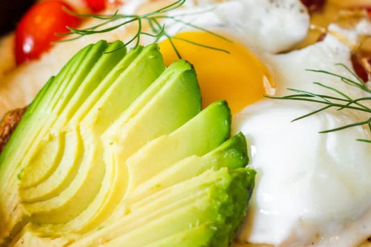 avocado next to egg, radish, and garnish