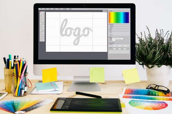 computer screen with 'logo' typed into a graphic design program