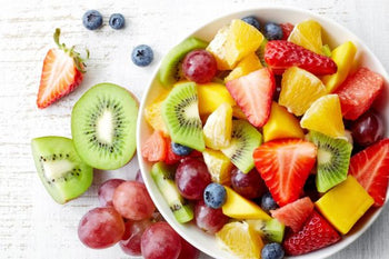 fruit salad with strawberries, oranges, grapes, kiwi, blueberries