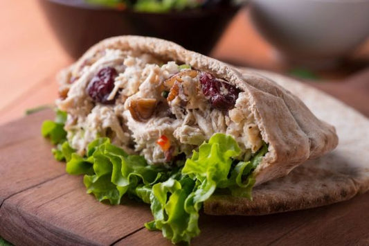 pears, lettuce, nuts inside of a pita