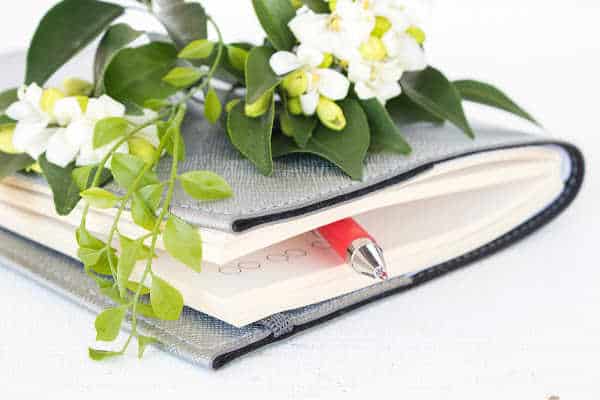 planner with flowers and pen