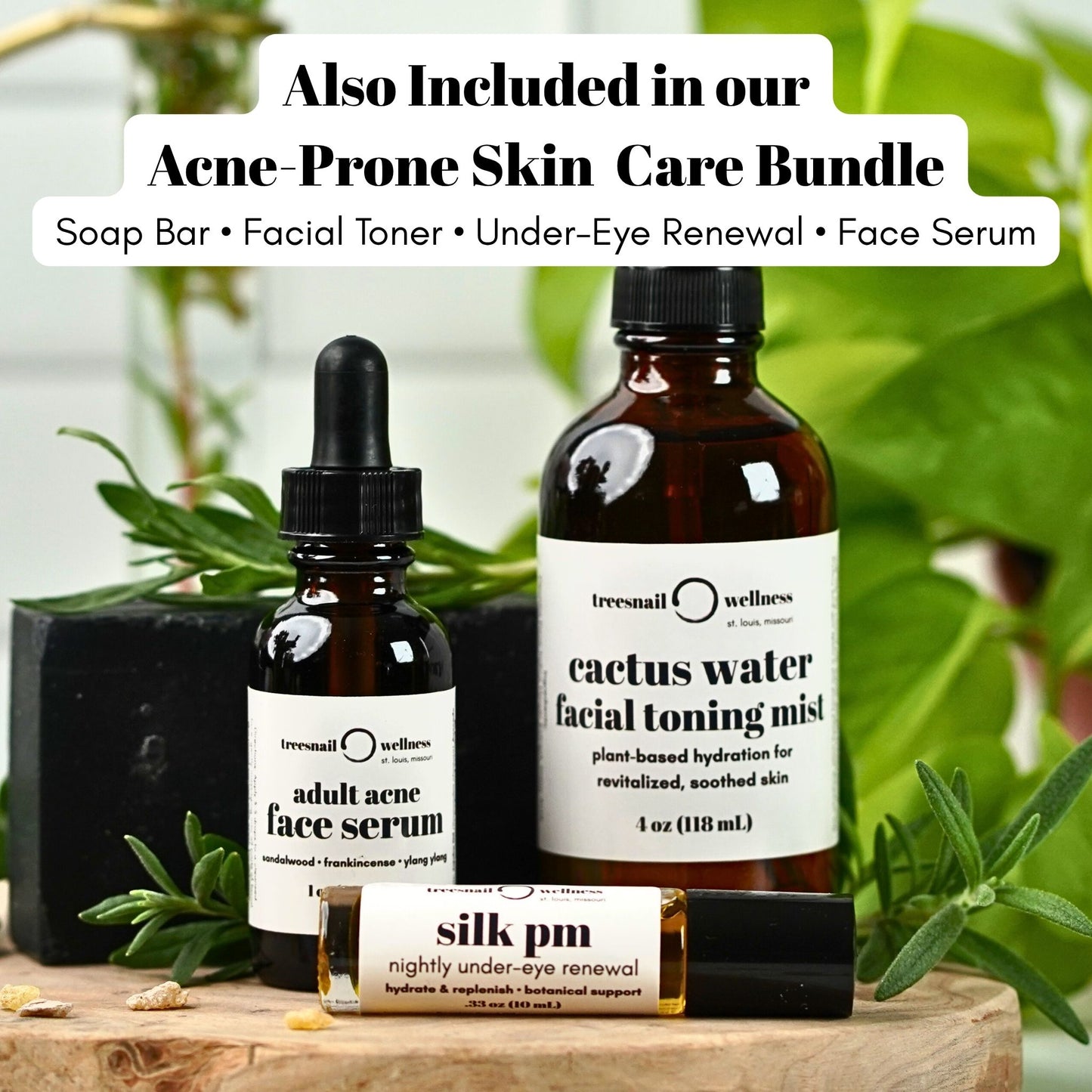 Acne-prone skin care products including a face serum, toner, soap bar, and renewal product on a wooden surface with greenery in the background.