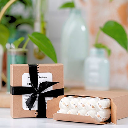 Square box of 10 organic lip balms .15 oz—ribbon-tied paperboard gift box, assorted essential-oil scents