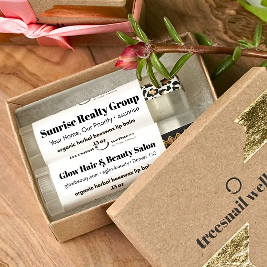Organic lip balm gifts for business promo in a sustainable box with Treesnail Wellness branding.
