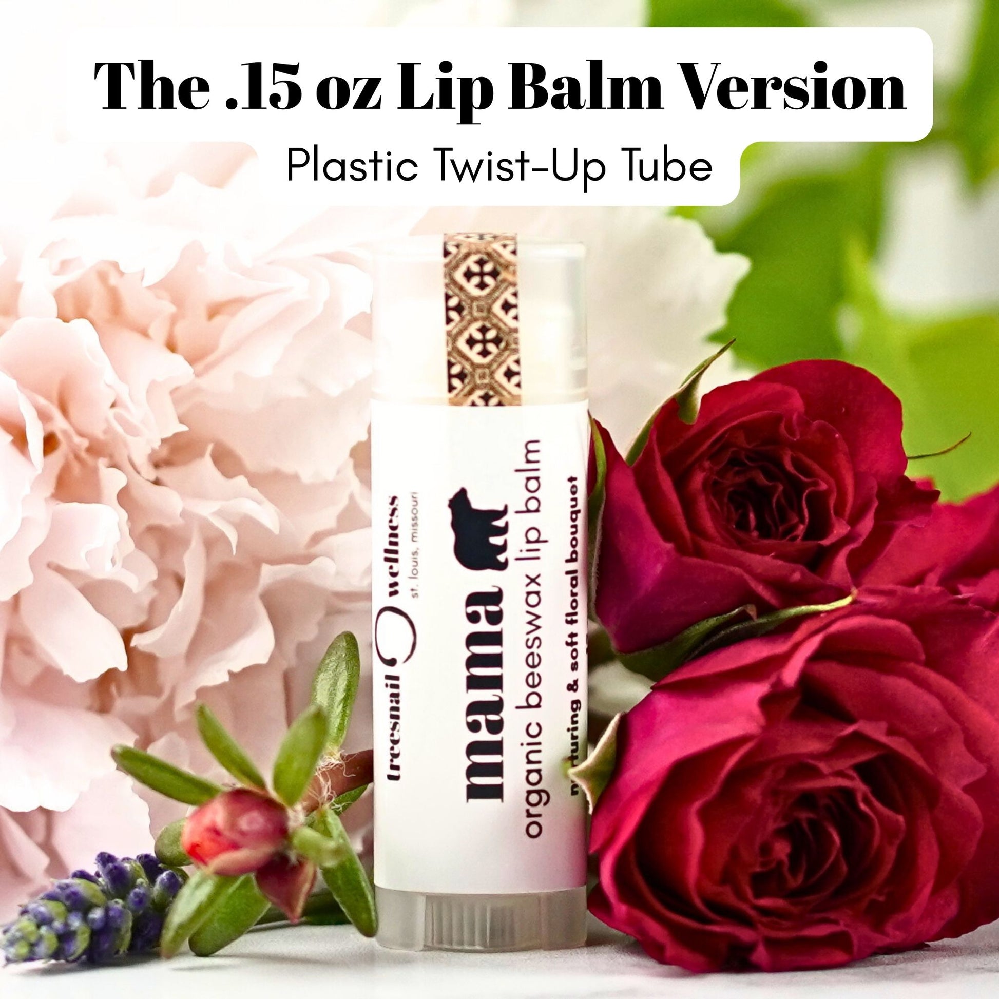 Plastic twist-up Lip balm tube with flowers in the background with Mama Bear organic beeswax lip balm label.