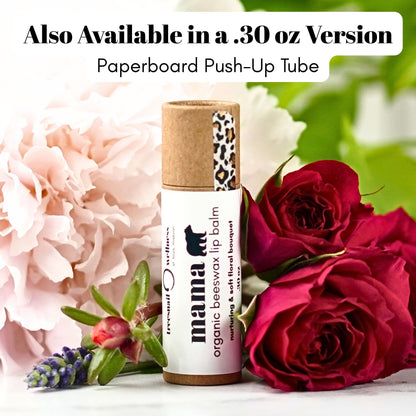 Lip balm with a paperboard push-up tube surrounded by flowers and roses.
