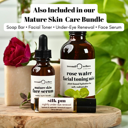 Skincare products including a face serum, toning mist, and eye renewal cream on a wooden surface with greenery in the background.