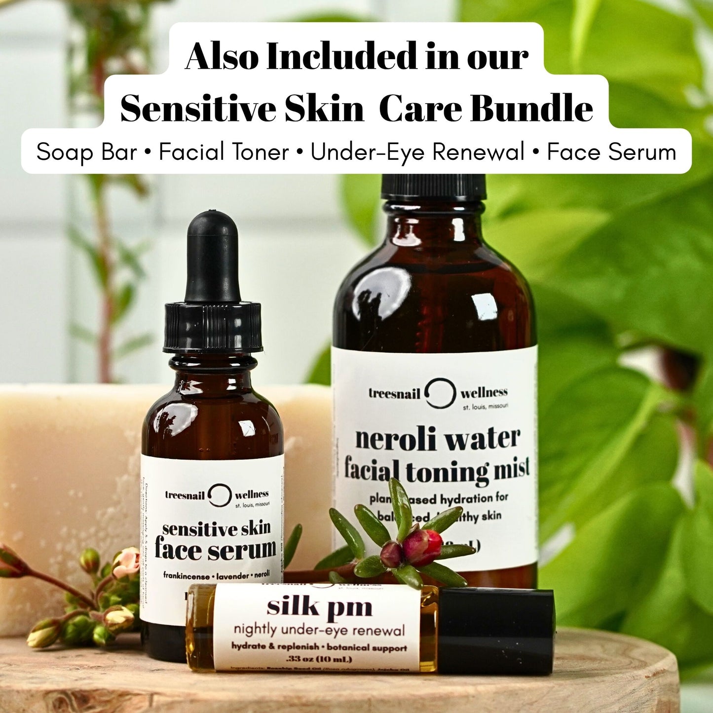 Treesnail Wellness skincare products including a fragrance free soap bar, sensitive skin face serum, neroli water toning mist, and under eye renewal on a wooden surface with a blurred green background.