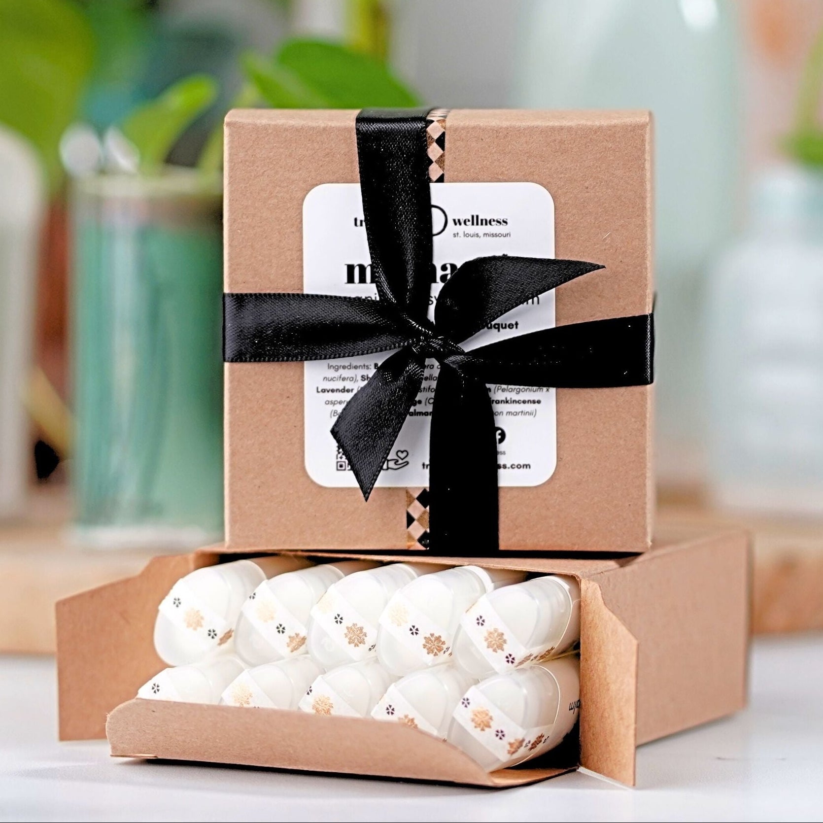 Square box of 10 organic lip balms .15 oz—ribbon-tied paperboard gift box, assorted essential-oil scents