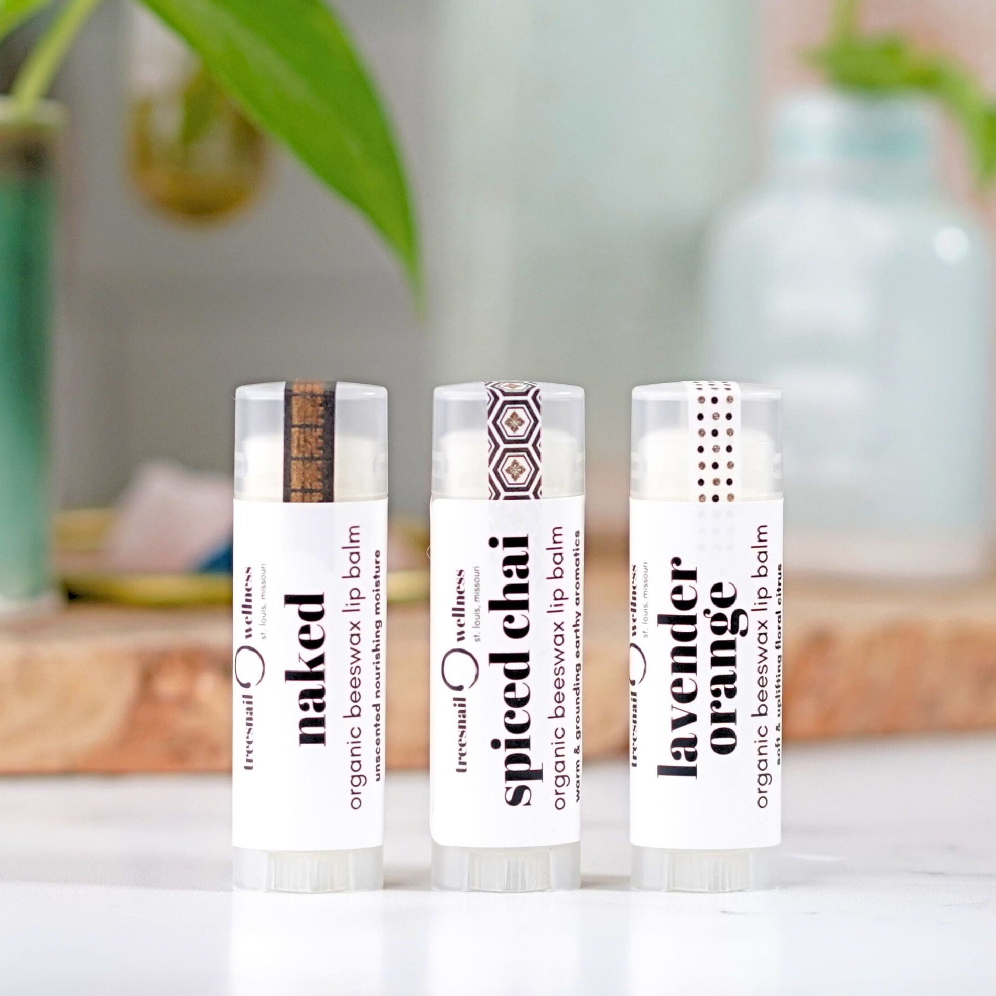 Mix & Match trio of organic .15 oz lip balms—paperboard gift box with black satin ribbon, assorted essential-oil scents
