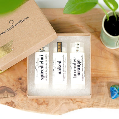 Mix & Match trio of organic .15 oz lip balms—paperboard gift box with black satin ribbon, assorted essential-oil scents