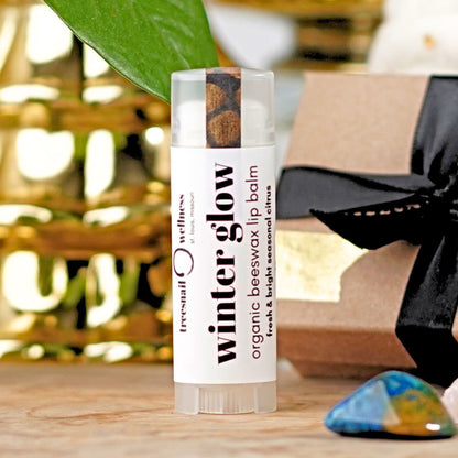 Winter Glow natural lip balm .15 oz plastic twist-up—grapefruit, orange, frankincense, balsam fir, ginger (seasonal Oct–Dec)