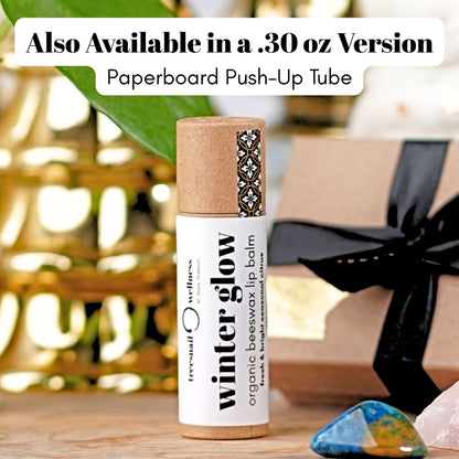 Winter Glow eco-tube lip balm .30 oz paperboard push-up—grapefruit, orange, frankincense, balsam fir, ginger (seasonal Oct–Dec)